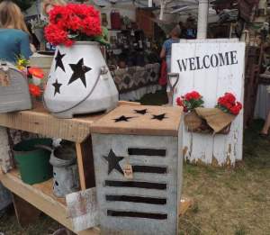 Metal containers such as old milk coolers and watering cans were turned into shabby chic fun. PHOTO BY CLAUDIA JACOBS